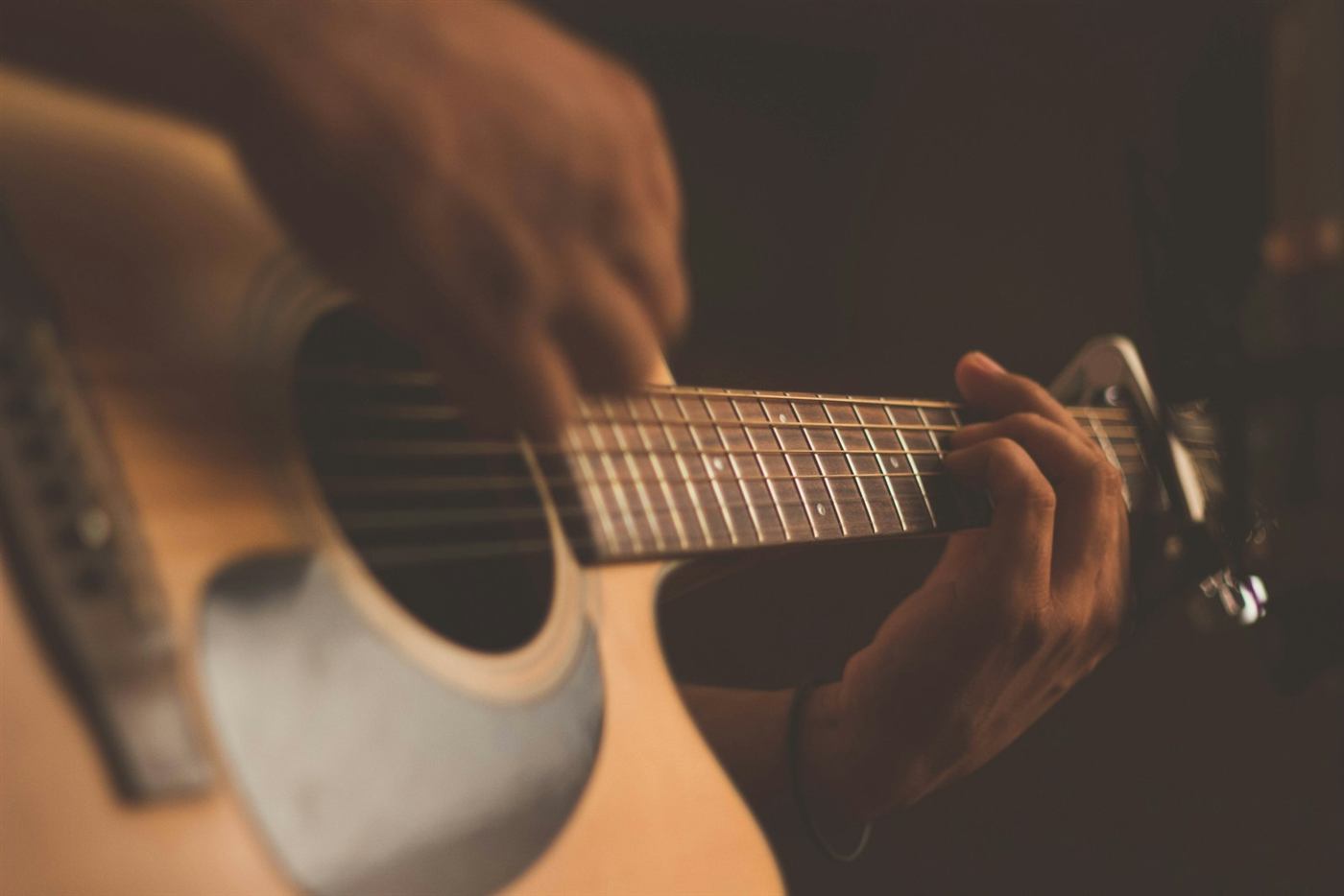 A musician holding a string instrument